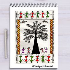 a spiral notebook with an image of a tree on the cover and people dancing around it