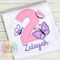 a pink and purple butterfly birthday shirt with the number two on it