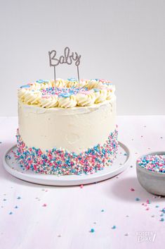 a birthday cake with sprinkles and a name on top