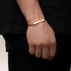 Featuring a modern and minimalistic design, this handmade gold bracelet embodies elegance and simplicity. The flat, bar-style cuff in a lustrous gold finish brings understated sophistication to any outfit. Its smooth surface and clean lines create a contemporary yet timeless look, perfect for adding a touch of luxury to both everyday and formal attire. Materials: -925 sterling silver, rhodium plated. OR - 18-karat gold or blackening. Weight: 14.5 gr American bracelet size: 7 - 10  (сustomized size available) Care: - Do not wear bracelet while swimming (especially in chlorinated pools or salt water), bathing, or washing dishes. Prolonged contact with moisture may accelerate tarnishing. - If your bracelet accidentally gets wet, immediately blot it with a soft cloth to avoid water spots. Gent Bracelet Men Gold, Mens Gold Bracelet, Gold Bracelet For Men, Real Gold Bracelet, American Bracelet, Gold Arm Band, Mens Cuff Bracelets, Bracelet Cuffs, Gold Schmuck