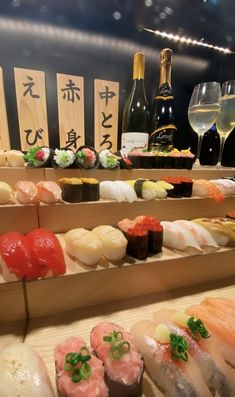 sushi and wine on display at a restaurant