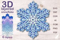 a snowflake cutout is shown in blue and purple on a wooden background