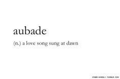 the word aubade is written in black and white with an image of a tree