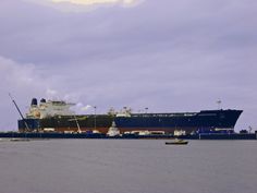 a large ship is docked in the water