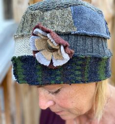 "This beautiful hat is made from recycled wool sweaters, that have been felted so they are thick and cozy.  The hat is made with coordinated Dark and Light Blue, and Cream wool. The hat has a removable felted flower with a vintage button in the center.  This pin can be removed, placed at the front or side of the hat, or worn as a matching pin on your coat.   Be sure to check out the mittens that match this hat, sold separately in my shop. Lined with grey fuzzy fleece that stretches so one size fits all adults, without slipping or pinching. Please feel free to convo me with any questions or comments at anytime. Sized: Medium ladies hat, one size fits all. Measurements:  Height of hat: 5\" (13 cm) Measurement around the hat: 26\" (66 cm) Hand wash, air dry flat." Fun Hats, Recycled Wool Sweater, Customer Gifts, Hat Styles, Felt Gifts, Wool Mittens, Dark And Light, Winter Hats For Women, Cute Hats