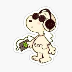 a cartoon dog wearing headphones and holding a camera sticker on a white background