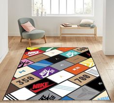 a colorful rug with nike logos on it in a living room next to a chair