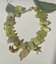 Handmade green chunky peridot rock beaded bracelet with faux gold charms of celestial designs Chunky Bracelets Beads, Bracelets Beads, Peridot Bracelet, Gold Charms, Chunky Bracelets, Green Peridot, Gold Charm, Jewelry Ideas, Beaded Bracelet