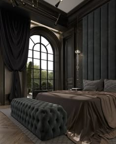 a large bed sitting in the middle of a bedroom next to a window with black drapes