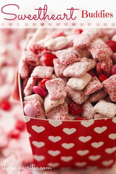 a red and white bowl filled with valentine's day treats