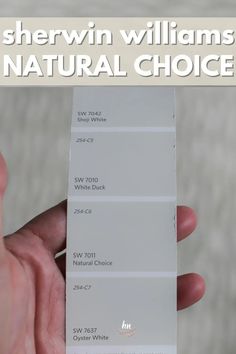 a person holding up a white card with the words sherwin williams natural choice