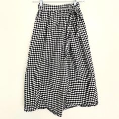 This is a lovely, light, size-inclusive wrap skirt, hand-made with 100% cotton. This is the perfect skirt for hot summer days and can be dressed up or down. Personally, I like to wear shorts while I bike to work in the summer, and then I throw this skirt on over the top. It's comfortable and stylish and has a lovely silhouette. Spring Vacation Gingham Bottoms, Summer Plaid Pleated Skirt, Plaid Beach Bottoms For Spring, Gingham Bottoms For Summer Picnic, Plaid Bottoms For Beach In Spring, Plaid Bottoms For Summer Picnic, Summer Plaid Wide-leg Bottoms, Summer Plaid Wide Leg Bottoms, Summer Plaid Bottoms For Picnic