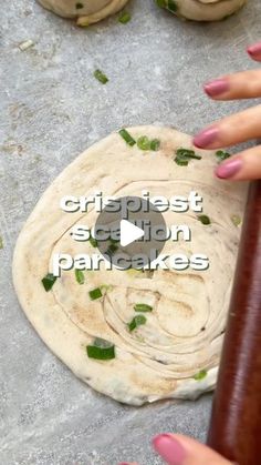 a person is making some food on a table