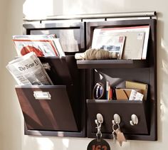 a wall mounted shelf filled with lots of items