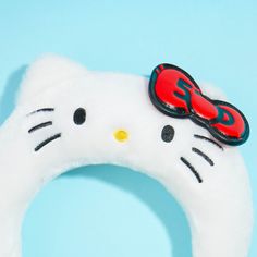 Instantly kawaii-fy your hair by wearing this fluffy white hairband! It has special embroidery of Hello Kitty’s face across the band, pop-out ears, and a faux leather red bow accent. This special headband was created in celebration of Hello Kitty’s 50th anniversary! Made from soft boa Hello Kitty Head Band, Hello Kitty Ears Headband, Hello Kitty Clips Hair, Hello Kitty Hairbrush, Hello Kitty Makeup Headband, White Hairband, Sanrio Characters, Red Bow, 50th Anniversary