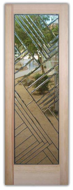 the reflection of a tree in a mirror on a wooden door with an abstract design