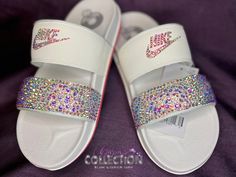 Custom Bling Women's Off Court Duo Slide Sandal 💜 Let me help you bring your custom creations to life! The possibilities are endless and I am open to creating any design that you have in mind. These are great for weddings, birthday gifts, special events, or just everyday wear. 💜 When placing your order please specify your desired color of the crystals in the PERSONALIZATION tab above, your crystals can consist of any color. I have access to every color. (Examples: AB or Clear). If you choose n Nike Benassi Slides, Nike Flip Flops, Nike Slides, Custom Bling, Adhesive Glue, Hen Party, Custom Shoes, All Design, Slide Sandals