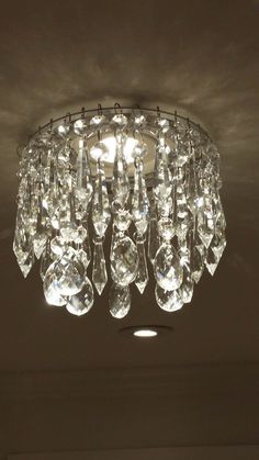 a chandelier hanging from the ceiling in a room