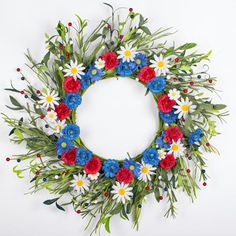 a wreath with red, white and blue flowers