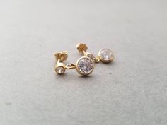 These 14k yellow gold filled earrings are small, simple and are great for every day wear! A crystal clear 6mm round CZ hangs from 14k Gold Filled 3mm CZ posts. Also available in sterling silver! Sterling earrings have a 6mm drop and a 4mm post. Find more rose and yellow gold earrings here: https://www.etsy.com/shop/IDreamofJewelry?ref=hdr_shop_menu&search_query=gold+earrings Please let me know if you have any questions! Yellow Gold Earrings, Earrings Round, Silver Bow, Gold Filled Earrings, Yellow Gold Earring, Round Earrings, Cute Earrings, Sterling Earrings, Crystal Clear