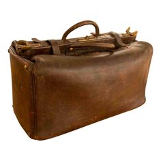 an old brown leather suitcase with handles