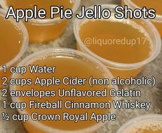 cups filled with apple pie jello shots sitting on top of a counter