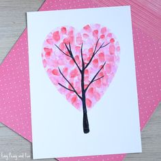 a heart shaped tree with pink leaves on it