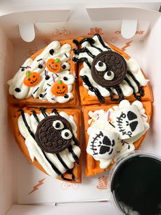 halloween themed waffles are in a box with white icing and sprinkles