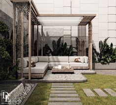 an outdoor living area with couches and tables