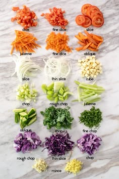 the ingredients for this vegetable salad are laid out on a marble counter top, including carrots, celery, onions, and other vegetables