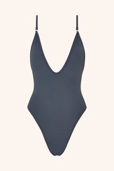 Turn heads with our iconic emerald green one-piece swimsuit. Featuring a stunning plunging neckline and a rich, vibrant hue, this design embodies confidence and sophistication with every splash. More than just swimwear, this emerald green one-piece is a true style statement. Cut & Fit Shaping, sculpting fit Pulls on Plunging neckline High-cut style with medium coverage brief Hardware & Straps All gold hardware Adjustable shoulders straps Lining & Fabric Double-lined  84% polyamide, 1 One Piece Bathers, Gooseberry Swimsuit, Black One Piece Bathing Suit, Gold One Piece, Brown One Piece, Grey One Piece, Purple One Piece, Green One Piece Swimsuit, One Piece Bathing Suits