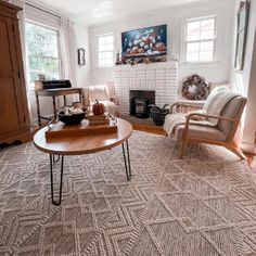 a living room filled with furniture and a fire place