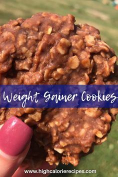 a close up of a person holding a cookie with the words weight gainer cookies on it