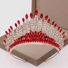 a red and white tiara in a box