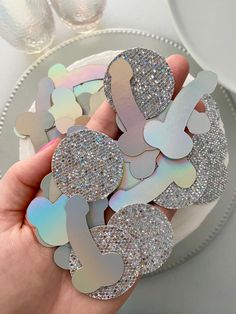 a person holding some glittered stickers in their hand