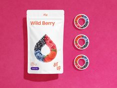 three bags of wild berry on a pink background