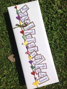 a bookmark that has been made to look like an arrow with words on it