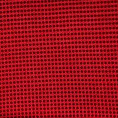 a red background with small circles on it