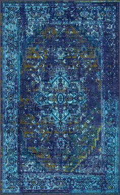 an area rug with blue and green colors