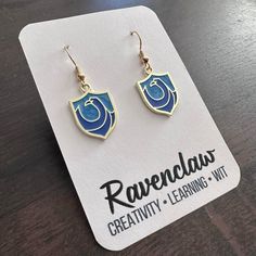 New Handmade Gold-Tone "Modern Ravenclaw Crest" Dangle Earrings (1.75" Long X 0.6" Wide) Ravenclaw Qualities Creativity Intelligence Learning Originality Wisdom Wit Ravenclaw Bracelet, Ravenclaw Earrings, Ravenclaw Necklace, Rowena Ravenclaw Diadem, Ravenclaw Merchandise, Harry Potter Jewelry, Moon Jewelry, Clay Necklace, Handmade Gold