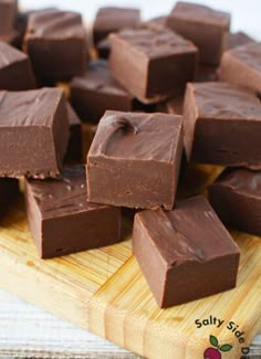 there are many pieces of chocolate on the cutting board