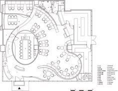 the floor plan for an office with tables, chairs and desks on each side