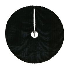 a black round object with a white circle in the middle