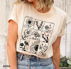 "Boho Wildflowers Cottagecore Shirt, Floral Vintage Botanical Tee, Nature T-shirt, Garden Lover Shirt, Aesthetic Floral Shirts for Women Our Unisex T-shirts are High Quality, SUPER soft and SUPER comfy. 👉FABRICATION * Solid Colors: 100% Ringspun Cotton * Heather Colors: 52% cotton, 48% polyester * Runs true to size 👉SIZING This style is a Unisex T-shirt. If you are unsure about the size you should order,  please refer to the size chart in the pictures. 👉CARE INSTRUCTIONS * Machine wash: warm Flower Shirt Design, Floral Shirts, Cottagecore Shirt, Aesthetic Floral, Botanical Shirt, Shirt Aesthetic, Shirt Design Inspiration, Nature Shirts, Mommy Style