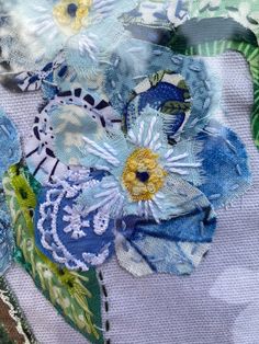 the fabric has been stitched together with flowers