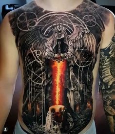 a man with tattoos on his chest has an image of angels and demons in the background