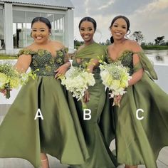 three women in green dresses standing next to each other