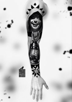 a person's arm with tattoos on it and a hand holding a lantern in the air