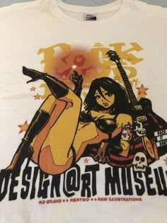 a t - shirt with an image of a woman holding a guitar