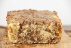 a piece of cake sitting on top of a wooden cutting board